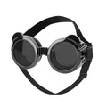 Dog goggles with round black frames, dark lenses, and adjustable strap