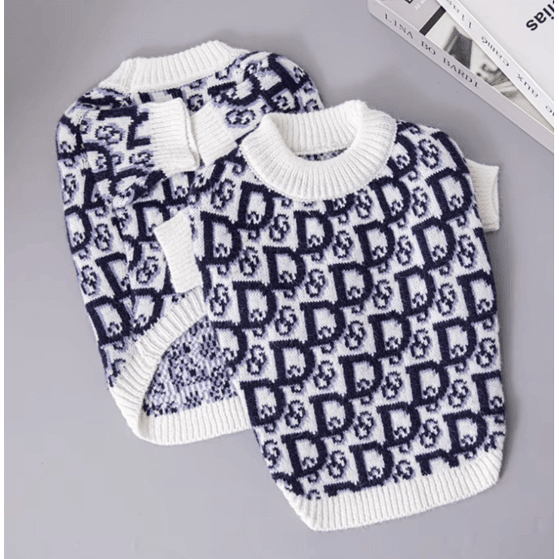 Dog sweater with navy-and-white knit logo pattern, ribbed crew neck and cuffs