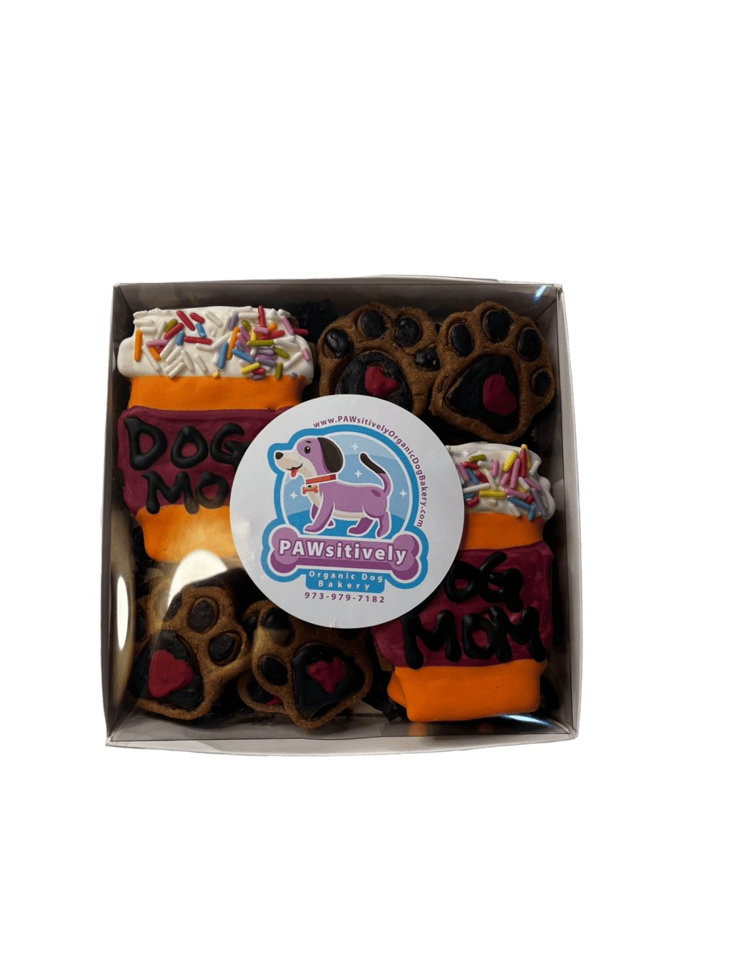 Boxed dog treat cookies with “Dog Mom” and paw shapes; label reads Pawsitively
