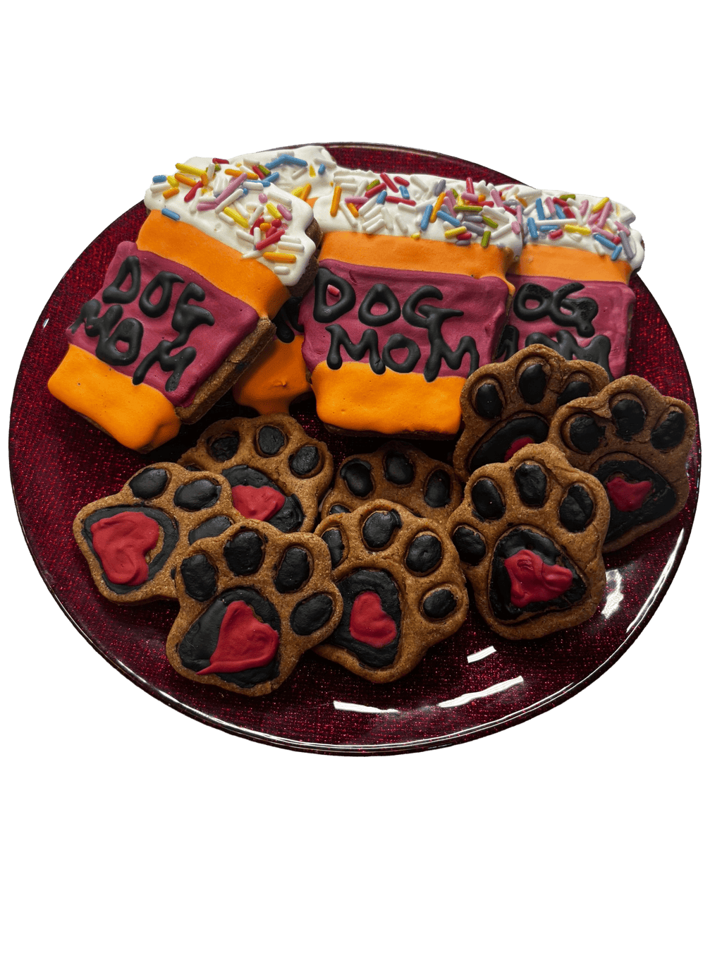 Assorted dog-themed cookies: black paw prints, orange bones, “Dog Mom” icing, sprinkles