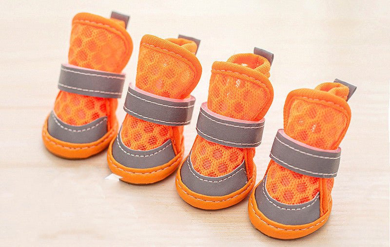 Small dog shoes in orange with gray straps and padded tops, set of four