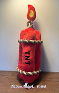 Red plush TNT bomb dog toy with rope loops and flame top