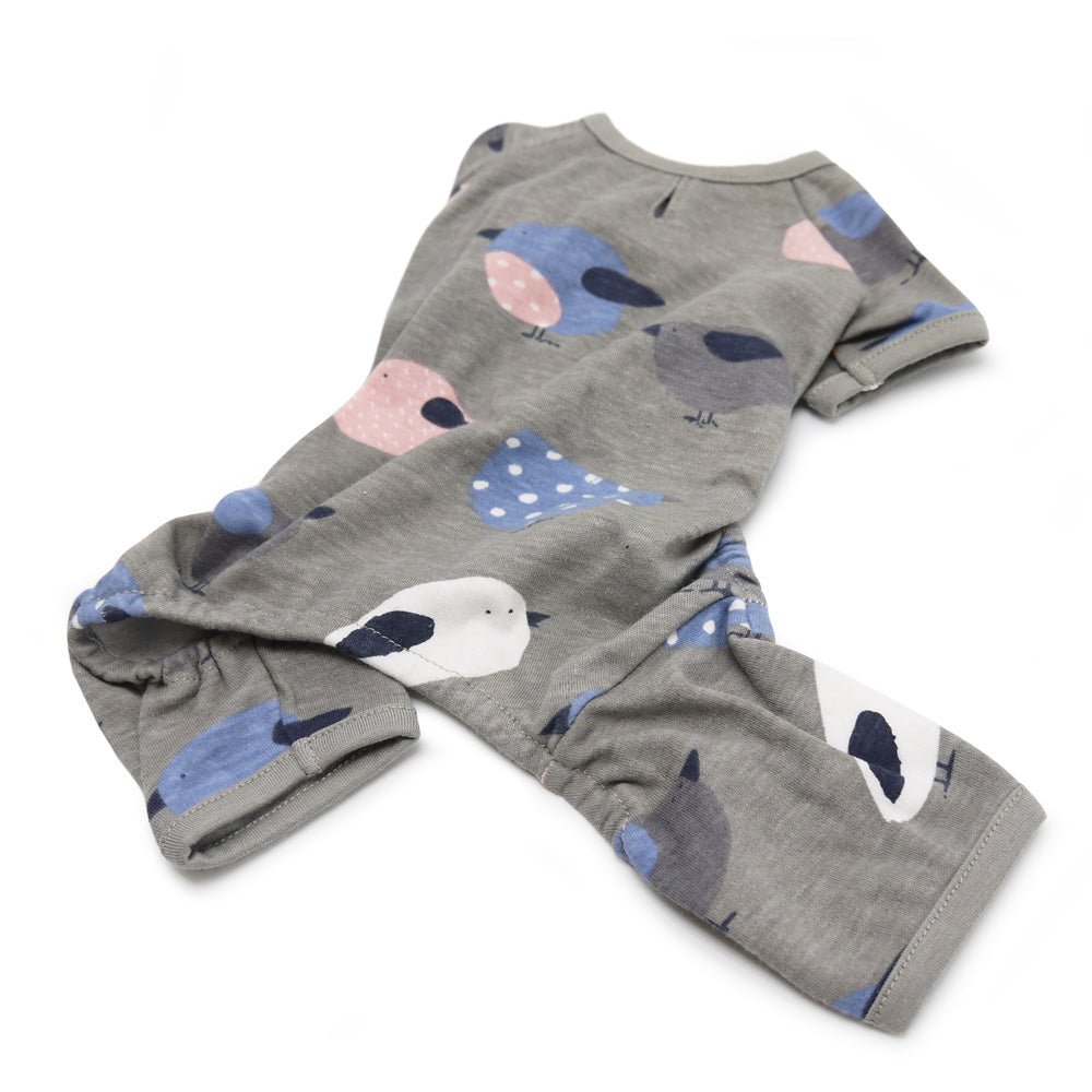 Gray dog pajamas with bird graphic print, shown laid out with sleeves and legs