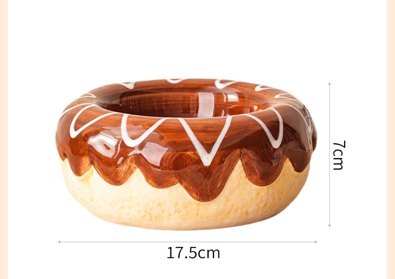 Brown donut-shaped ceramic pet bowl with white zigzag lines and glossy inner glaze