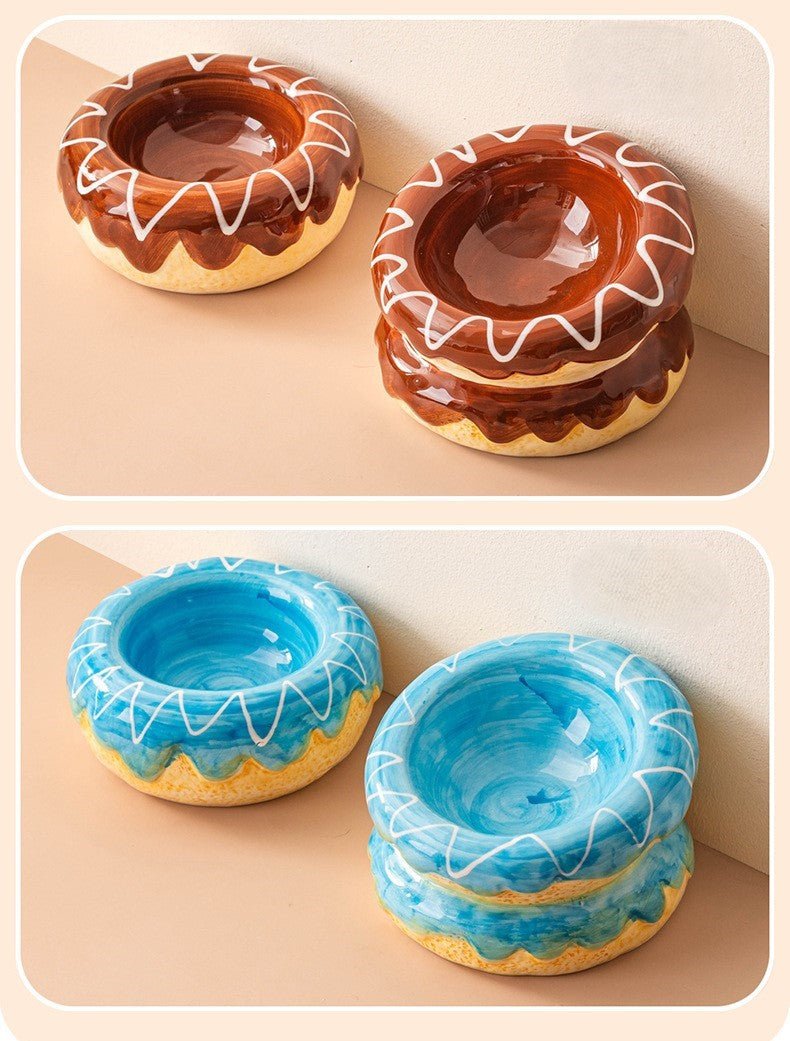 Donut ceramic pet bowls in brown and blue, each with white swirl lines on glossy glaze