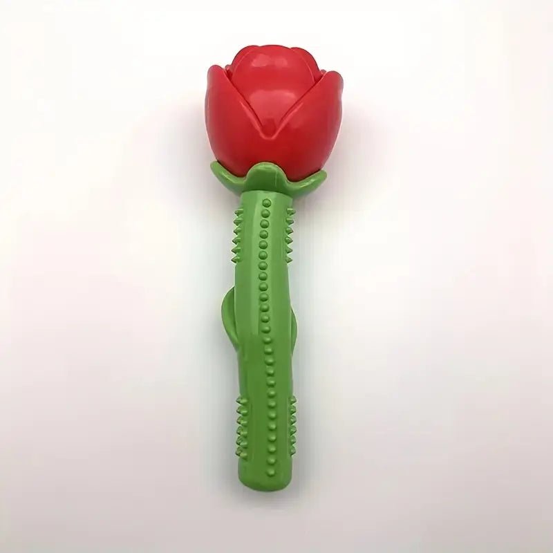 Red rose-shaped rubber squeaker dog chew toy with green textured handle