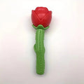 Red rose-shaped rubber squeaker dog chew toy with green textured handle