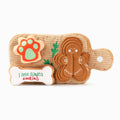Tan plush dog cookie board toy with gingerbread dog face, paw print, and candy cane accents