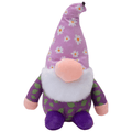 Purple plush gnome dog toy with flower print, white beard, and round pink nose