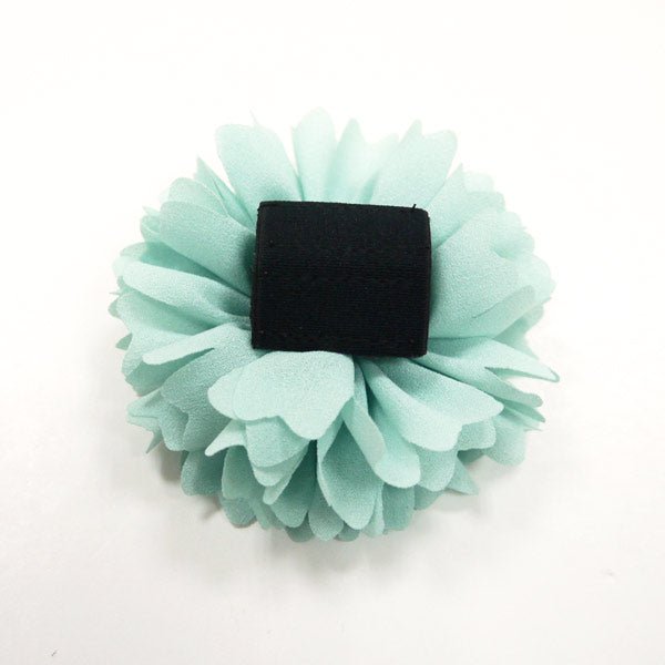 Light blue flower bow with rhinestone center and black rectangular clip backing