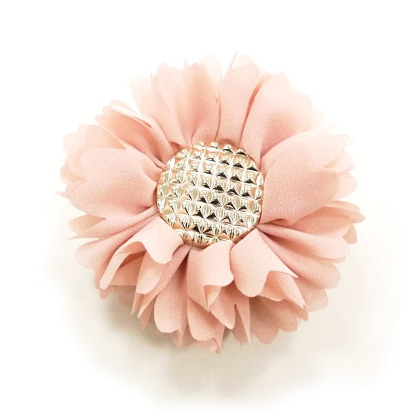 Peach-pink flower bow with textured rhinestone center and layered fabric petals
