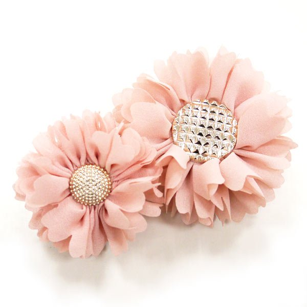 Two soft pink flower bows with rhinestone centers and layered fabric petals