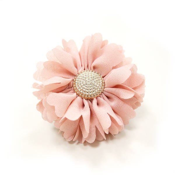 Soft pink flower bow with round rhinestone center and layered fabric petals