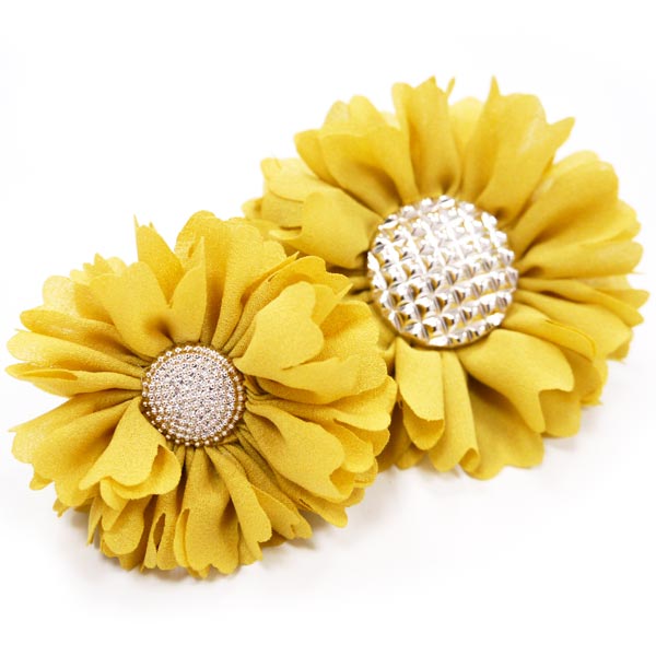 Two yellow fabric flower rosettes with rhinestone button centers.