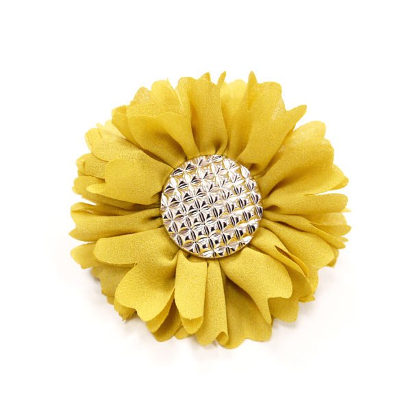 Yellow fabric flower rosette with silver rhinestone button center.