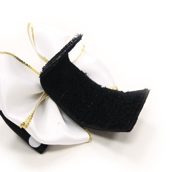 Black bow tie ribbon tail with gold thread edge detail