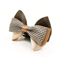 Beige bow tie with black-and-white houndstooth center and brown outer loops