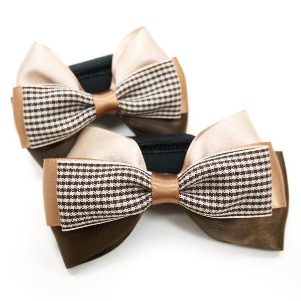 Bow tie with beige and brown loops and a black-and-white houndstooth center