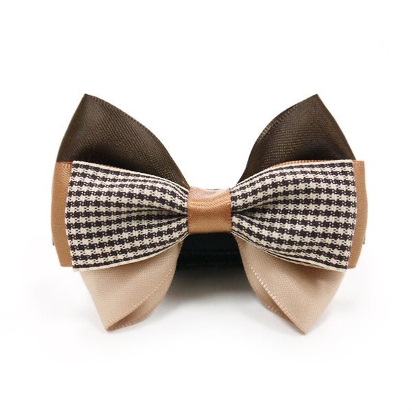 Beige bow tie with brown outer loops and black-and-white houndstooth wings