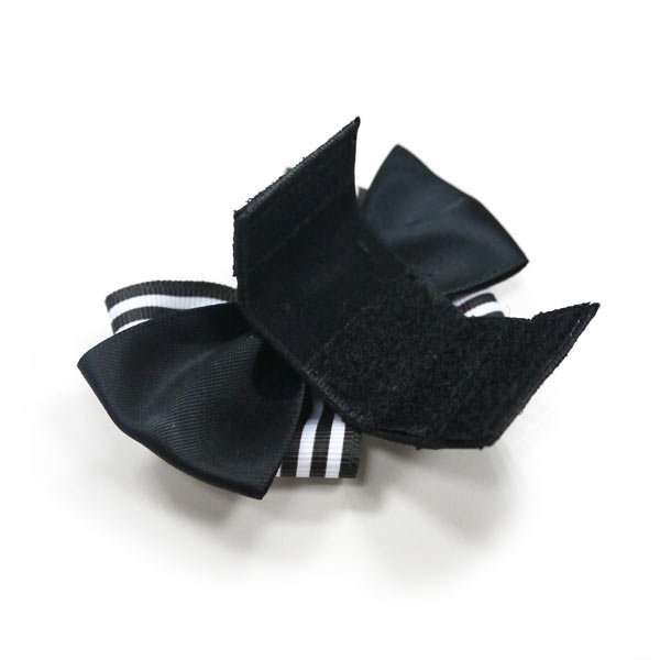 Bow tie with black textured fabric and striped edge