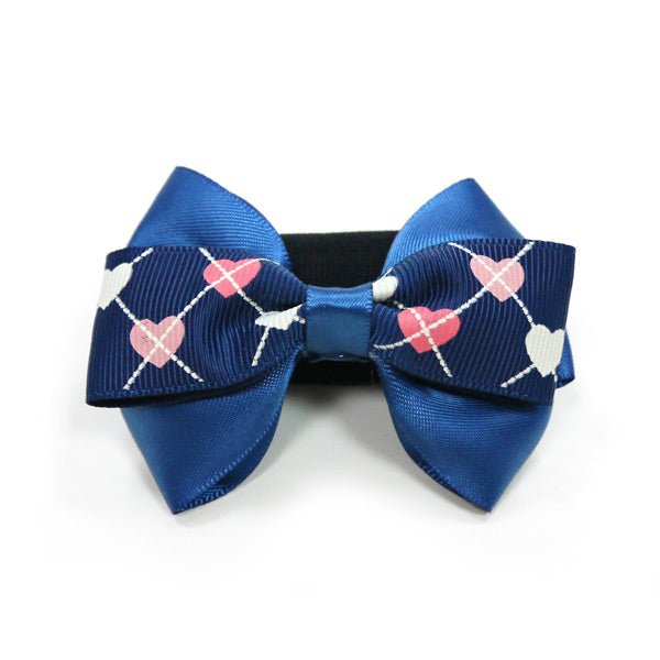 Blue and navy patterned bow tie with black center band, front view