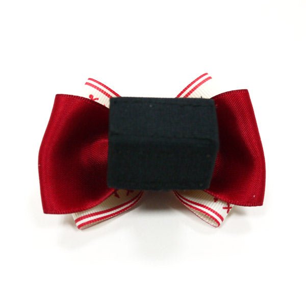 Nautical hair bow with red satin sides, black back clip, and striped underside
