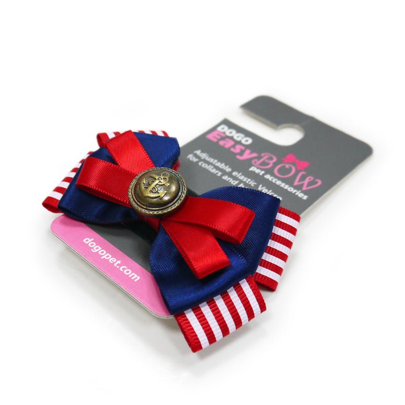 Nautical pet bow with red and blue ribbons, red knot, and gold button centerpiece
