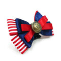 Nautical pet bow with red/white striped ribbon, dark blue loops, and gold button medallion
