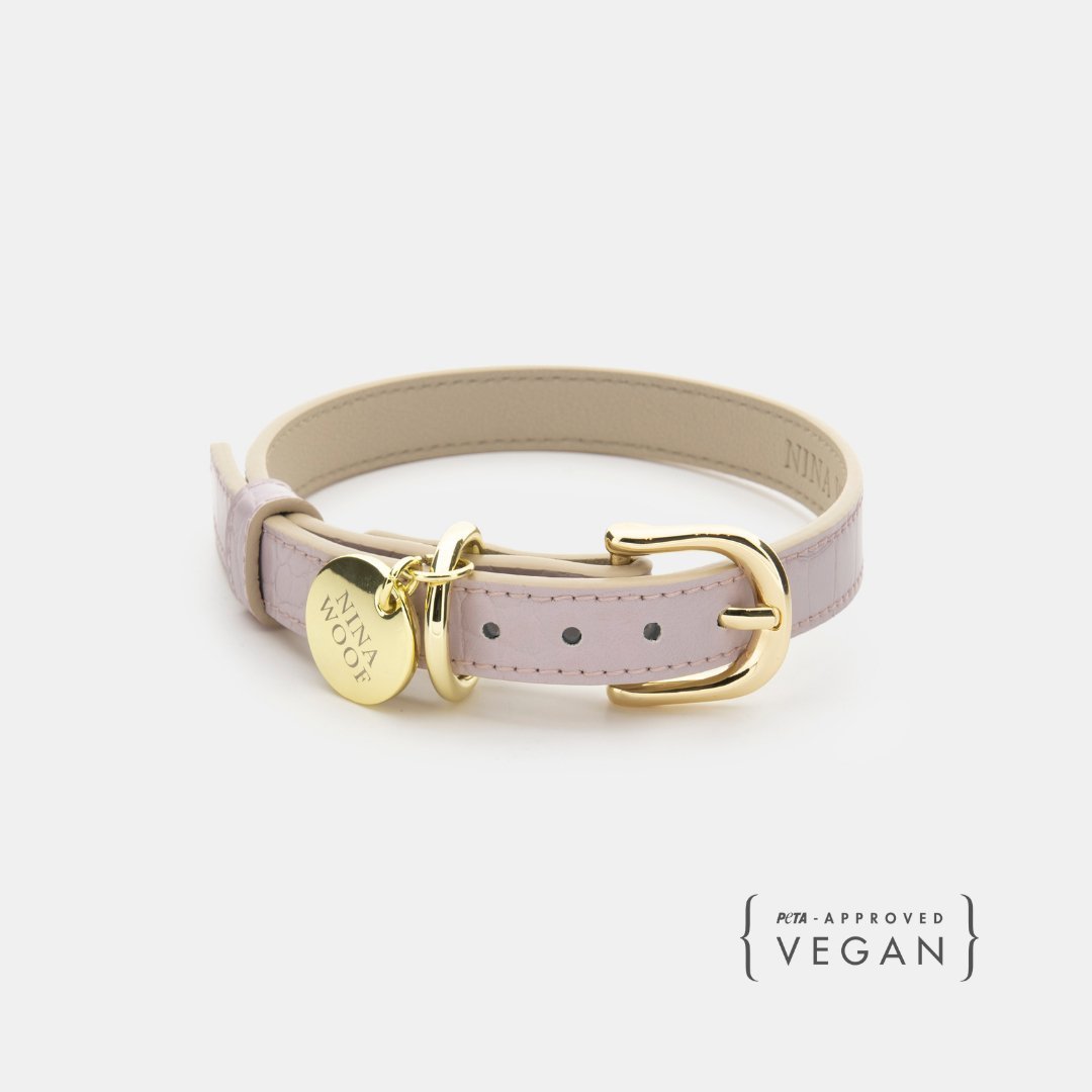 Beige vegan leather dog collar with gold buckle and studded strap holes