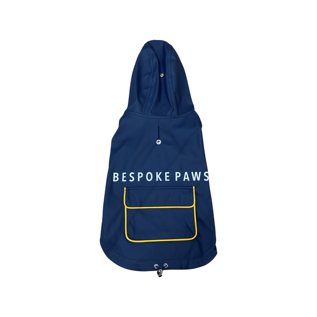 Navy pet raincoat with hood, yellow piping pocket, and snap buttons