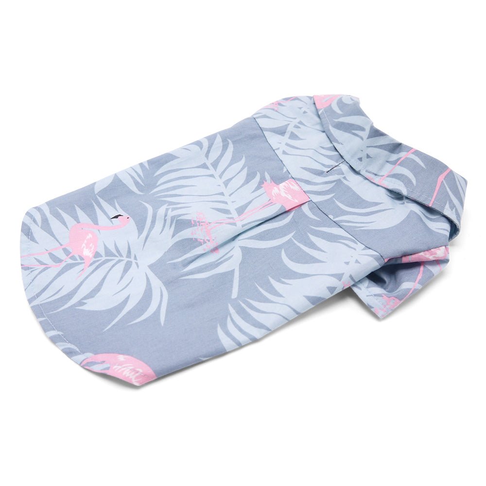 Light blue pet shirt flat lay with pink flamingo and leaf print, long hem
