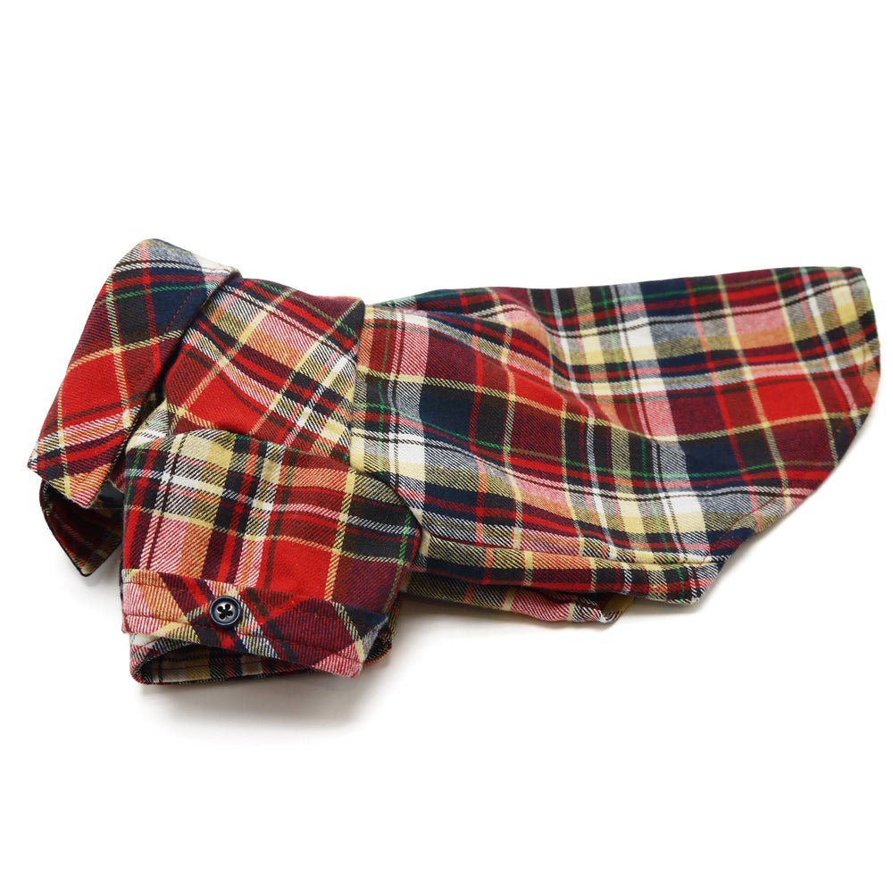 Red plaid flannel button-down shirt laid flat with sleeve and button details