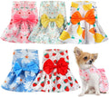 Floral sleeveless dog dress with bow skirt, pink, teal, and orange-yellow designs