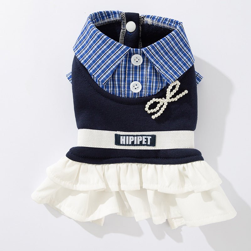 Navy and blue plaid ruffled pet dress with white collar, buttons, and bow