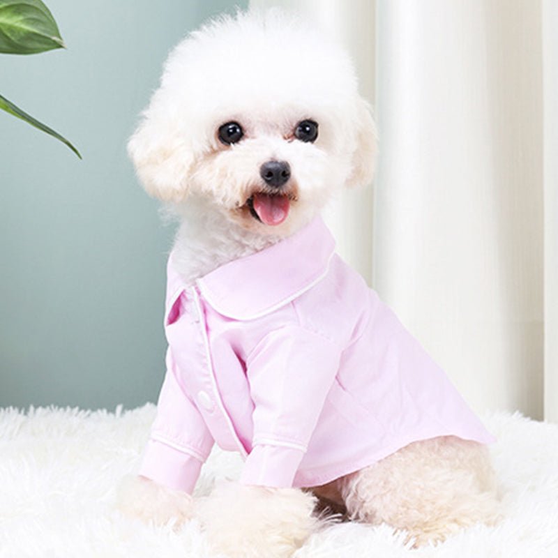 Pink dog pajama shirt with hooded neckline and snap-button front