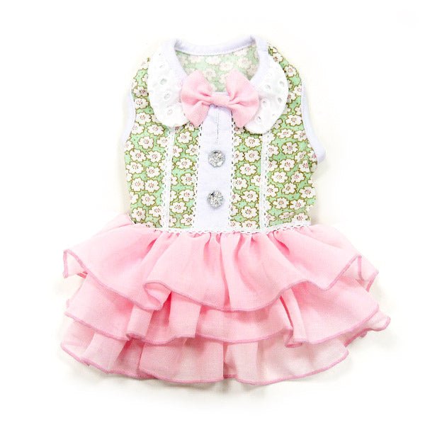 Pet dress top view: green floral vest with white buttons and pink bow