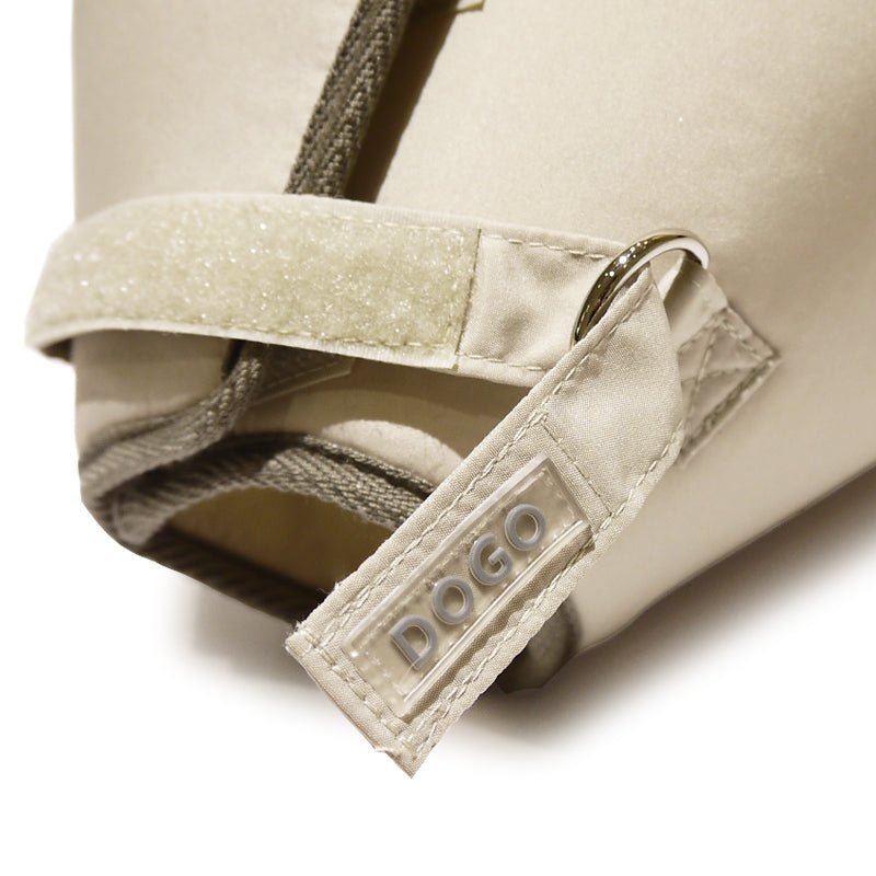 Beige E-collar recovery neck brace close-up with adjustable strap and DOGO logo patch