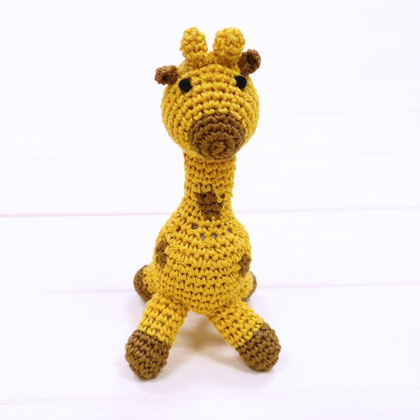 Crochet giraffe plush with brown snout spots, upright pose, long legs