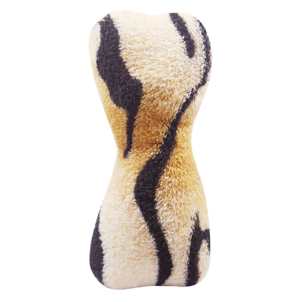 Plush zebra-pattern bone toy in cream with dark stripe details.