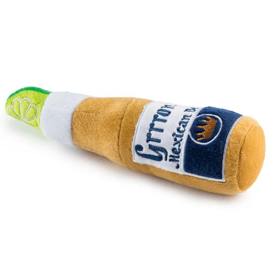 Plush beer-bottle dog toy side view, brown fabric, white band, green cap, blue logo label