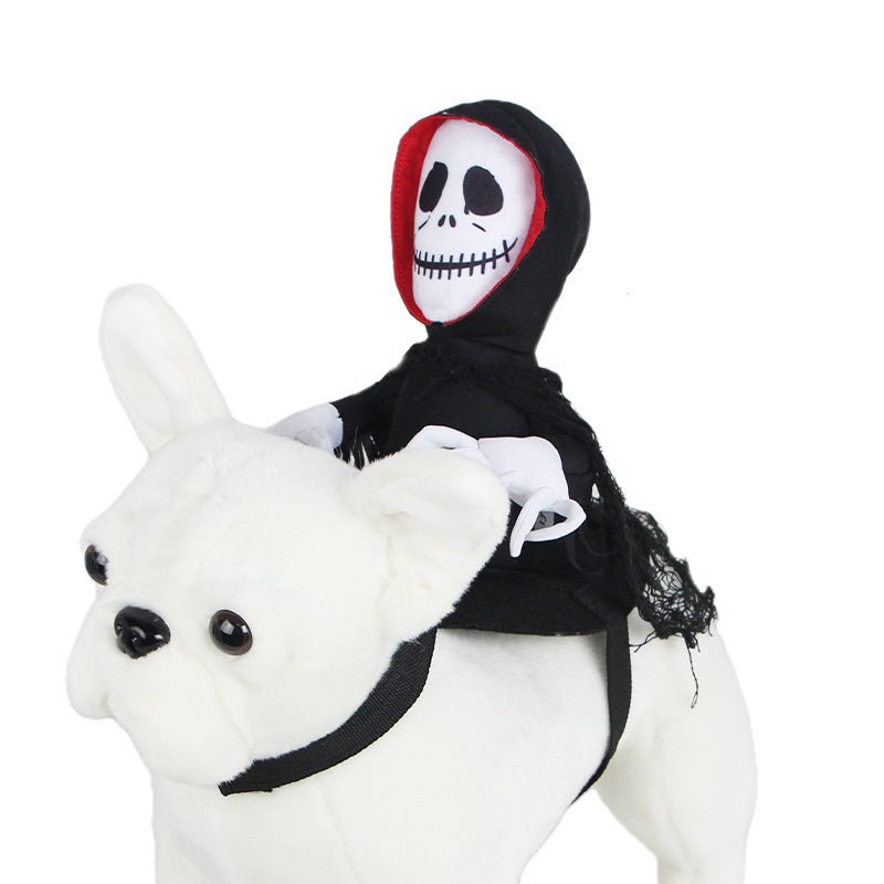 Black hooded pet cape with skull face patch and red edge trim on plush white rabbit