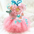 Pink pet dog dress with layered tulle skirt, floral embroidery, and blue trim straps