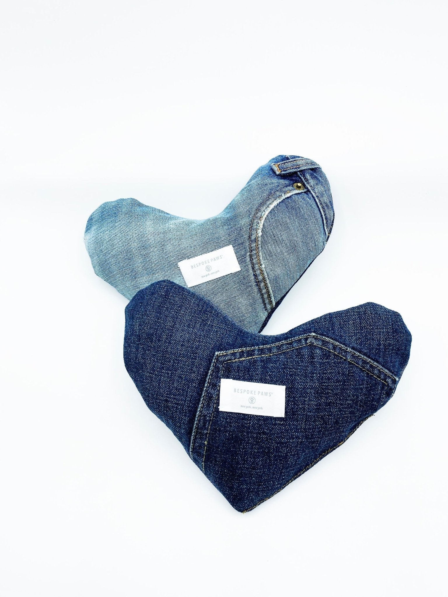 Heart-shaped denim toy with contrasting seams, one light blue and one dark blue heart