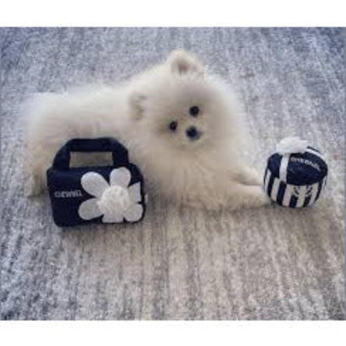 Plush dog toy set with handle pouch, white flower, and striped ball