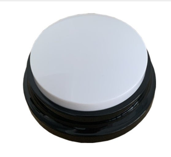 White interactive dog sound button with black base and round top