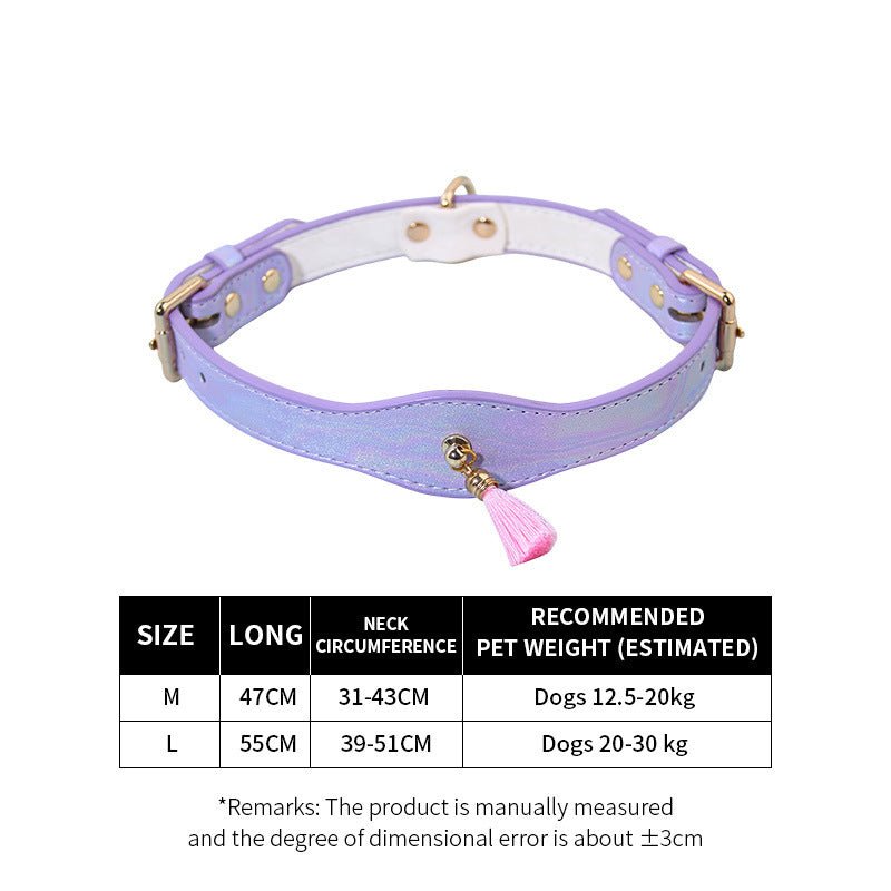 Purple adjustable dog collar with pink tassel, brass hardware, and multiple strap holes