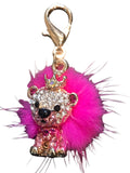 Pink faux-fur dog collar charm with rhinestone crown and gold-tone clip