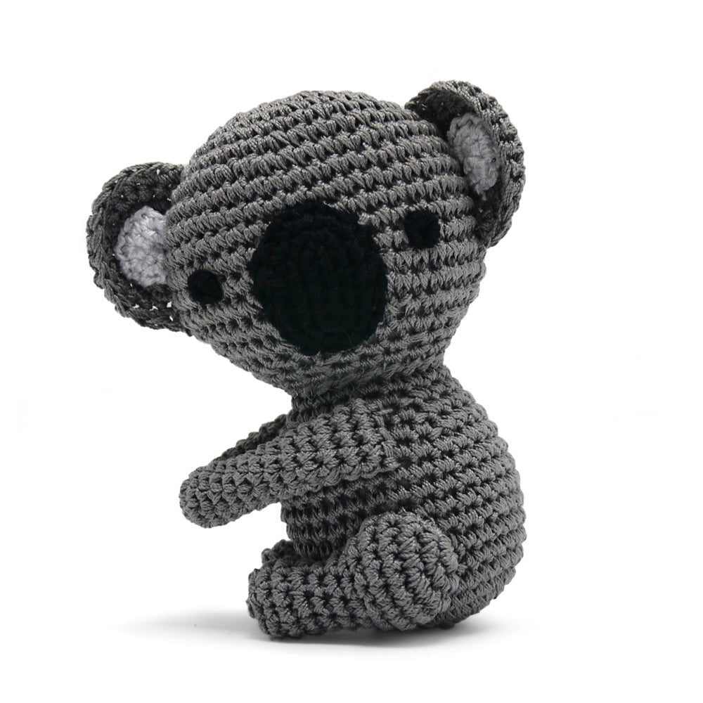 Crocheted koala toy in gray with black nose and round ears, sitting pose