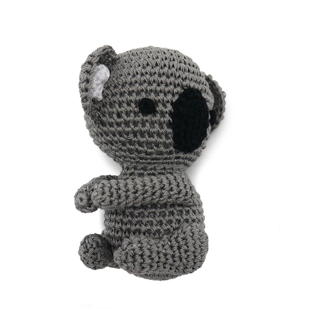 Gray crocheted koala plush toy with black nose, side view, small arms