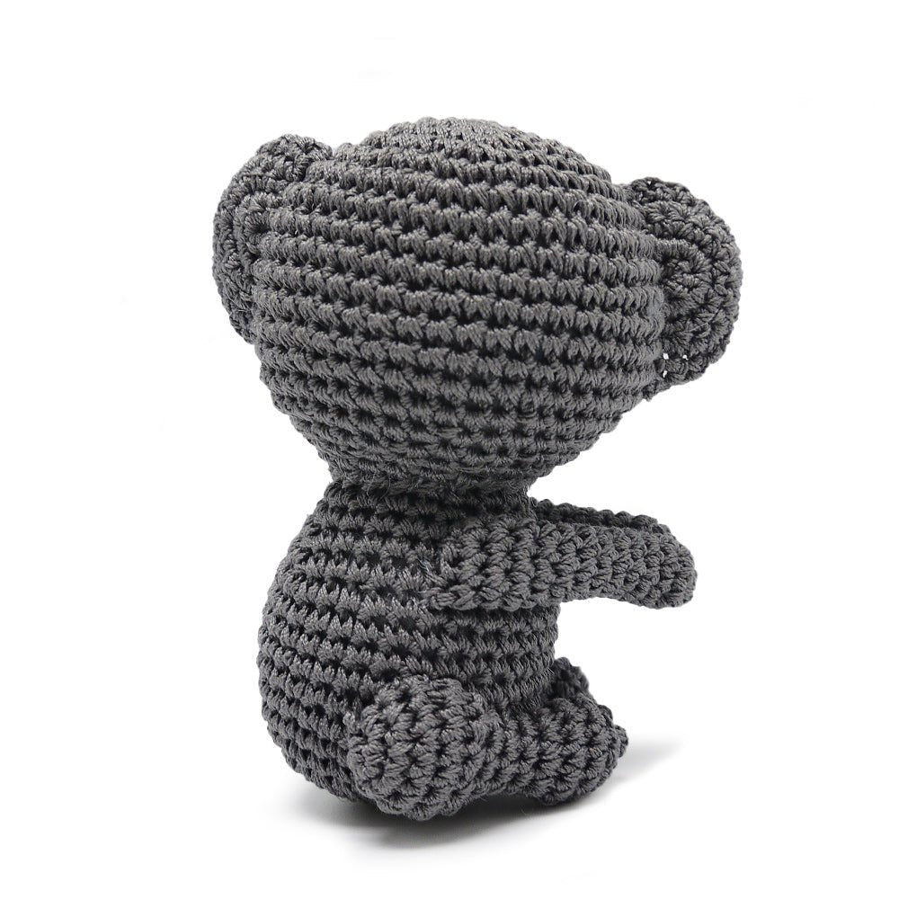 Crochet koala toy in dark gray with black nose, standing pose, small tail
